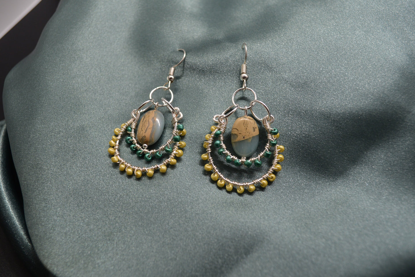 Layered Wire Wrapped Hoop Earrings With Green Center Stone, Green and Yellow accents.