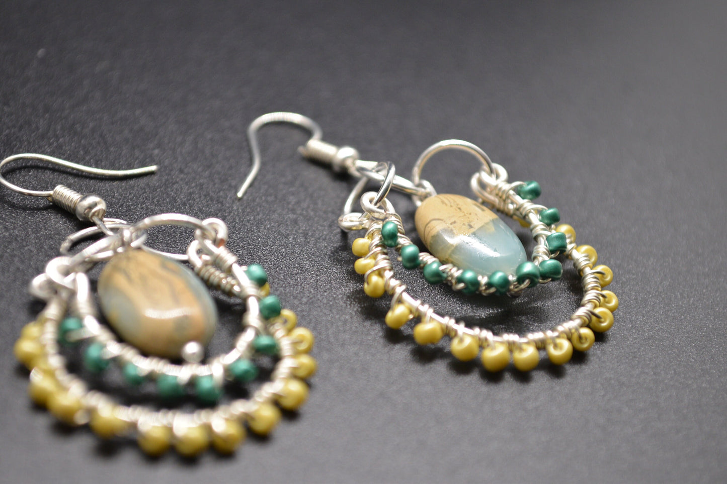 Layered Wire Wrapped Hoop Earrings With Green Center Stone, Green and Yellow accents.