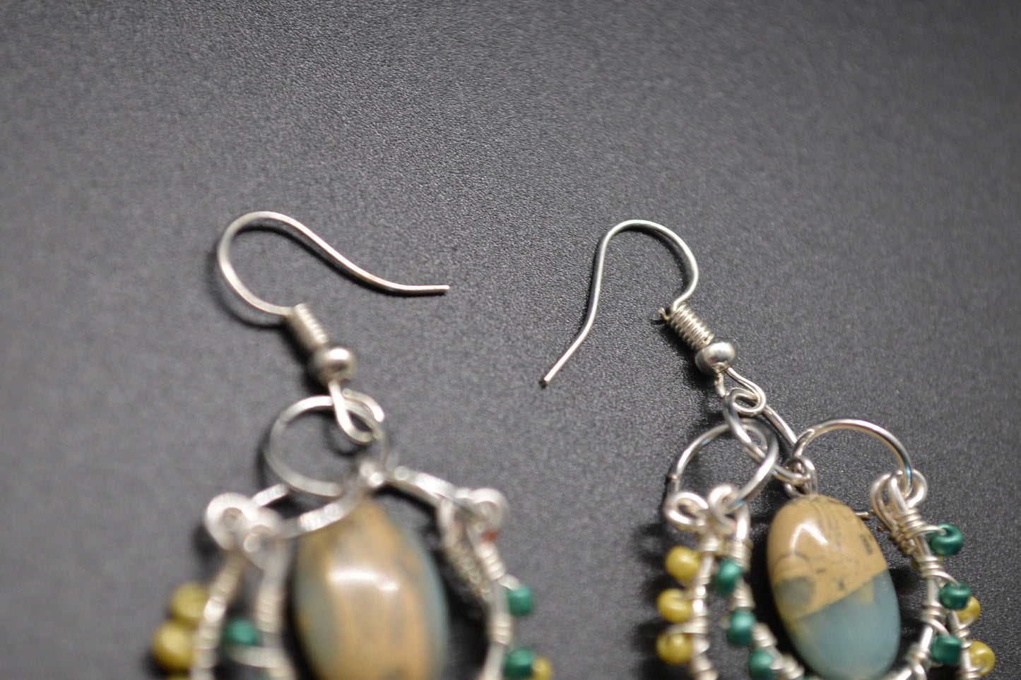 Layered Wire Wrapped Hoop Earrings With Green Center Stone, Green and Yellow accents.