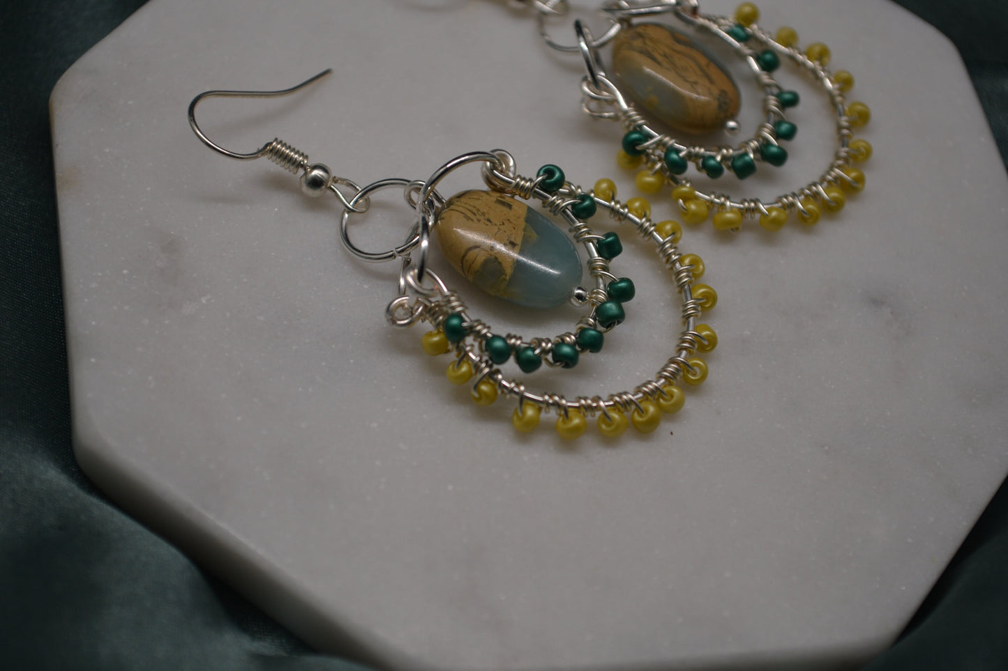 Layered Wire Wrapped Hoop Earrings With Green Center Stone, Green and Yellow accents.