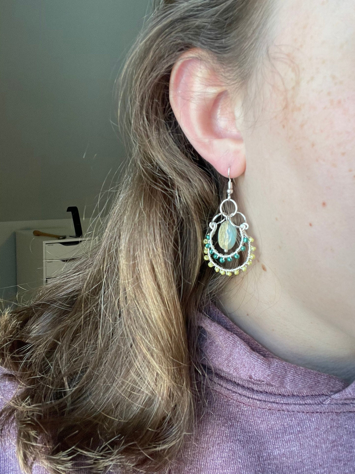 Layered Wire Wrapped Hoop Earrings With Green Center Stone, Green and Yellow accents.