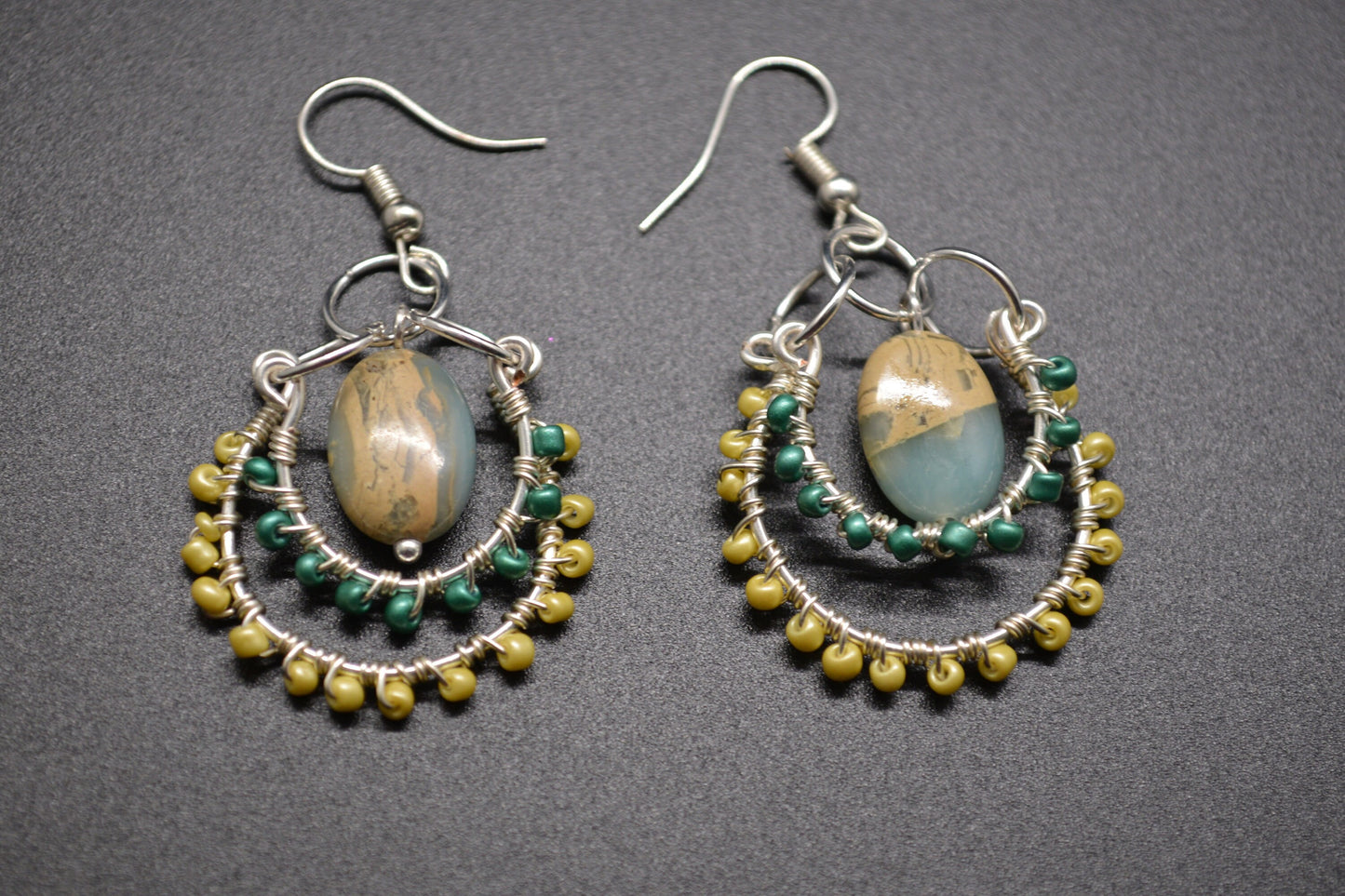 Layered Wire Wrapped Hoop Earrings With Green Center Stone, Green and Yellow accents.